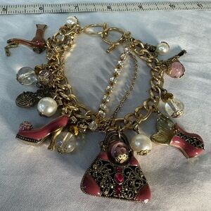 Goldtone and pink enamel charm statement bracelet